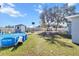 Spacious backyard with above ground pool, shed, and basketball hoop at 2986 Sw 143Rd Place Rd, Ocala, FL 34473