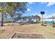 Large backyard with basketball hoop and garden at 2986 Sw 143Rd Place Rd, Ocala, FL 34473