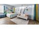 Bright bedroom featuring a comfortable bed and a convenient sofa at 2986 Sw 143Rd Place Rd, Ocala, FL 34473