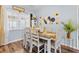 Charming dining room featuring a rustic table and yellow accents at 2986 Sw 143Rd Place Rd, Ocala, FL 34473
