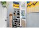 Inviting entryway with built-in shoe storage and welcoming decor at 2986 Sw 143Rd Place Rd, Ocala, FL 34473