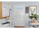 Bright and airy entryway with a console table and decorative mirror at 2986 Sw 143Rd Place Rd, Ocala, FL 34473
