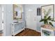 Welcoming entryway, hardwood floors, console table, and decor at 2986 Sw 143Rd Place Rd, Ocala, FL 34473