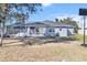 Back of house, screened patio, and yard at 2986 Sw 143Rd Place Rd, Ocala, FL 34473