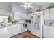 Well-equipped kitchen boasting white appliances and ample counter space at 2986 Sw 143Rd Place Rd, Ocala, FL 34473