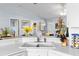 Kitchen features a corner sink and white countertops at 2986 Sw 143Rd Place Rd, Ocala, FL 34473