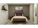 Modern bedroom with a stylish bed and a bench at the foot at 1953 Sarah St, Winter Haven, FL 33884