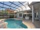 Relaxing pool with covered patio and outdoor kitchen at 7657 Mount Carmel Dr, Orlando, FL 32835