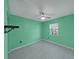 Mint green bedroom with tile floors and a ceiling fan at 7216 Fox Chase Dr, Lakeland, FL 33810