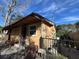 Side view of a small house with a fence and yard at 1228 35Th Nw St, Winter Haven, FL 33881