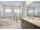 Spa-like bathroom with a soaking tub, walk-in shower, and modern vanity at 7650 Fairfax Dr, Kissimmee, FL 34747
