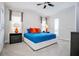 Relaxing bedroom with a comfortable king-size bed and stylish decor at 7650 Fairfax Dr, Kissimmee, FL 34747