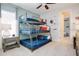 Bedroom with a triple bunk bed and Star Wars decor at 7650 Fairfax Dr, Kissimmee, FL 34747