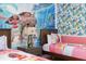 Bedroom with Moana themed twin beds and mural at 7650 Fairfax Dr, Kissimmee, FL 34747