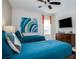 Serene bedroom with twin beds, featuring a calming color palette and plenty of natural light at 7650 Fairfax Dr, Kissimmee, FL 34747