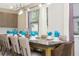 Modern dining room with large table and seating at 7650 Fairfax Dr, Kissimmee, FL 34747