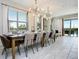 Spacious dining room with large table and access to the pool at 7650 Fairfax Dr, Kissimmee, FL 34747