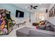Game room with arcade game and comfortable seating at 7650 Fairfax Dr, Kissimmee, FL 34747