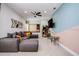 Spacious game room, perfect for entertainment, features a large sectional sofa and arcade game at 7650 Fairfax Dr, Kissimmee, FL 34747