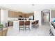 Modern kitchen with island, stainless steel appliances, and breakfast bar at 7650 Fairfax Dr, Kissimmee, FL 34747