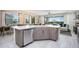 Modern kitchen with large island and stainless steel appliances at 7650 Fairfax Dr, Kissimmee, FL 34747