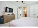 Bright main bedroom with large bed, ensuite bathroom, and ample closet space at 7650 Fairfax Dr, Kissimmee, FL 34747