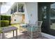Relaxing patio with wicker chairs and a small table at 7650 Fairfax Dr, Kissimmee, FL 34747