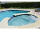 Inviting pool and spa with ample patio space at 7650 Fairfax Dr, Kissimmee, FL 34747