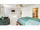 Spacious bedroom with a comfy chair and en-suite bathroom at 1885 Red Loop, Lakeland, FL 33801