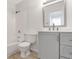 Updated bathroom with grey vanity, new fixtures, and stylish mirror at 7340 Daniel Webster Dr # 6, Winter Park, FL 32792