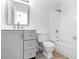Clean and modern bathroom with grey vanity, updated toilet and bathtub at 7340 Daniel Webster Dr # 6, Winter Park, FL 32792