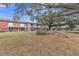 Community featuring a grassy yard and brick buildings at 7340 Daniel Webster Dr # 6, Winter Park, FL 32792