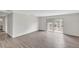 Spacious living room with wood-look flooring and access to a private balcony at 7340 Daniel Webster Dr # 6, Winter Park, FL 32792