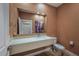 Modern bathroom with floating vanity and large mirror at 7482 Brooklyn Dr, Kissimmee, FL 34747