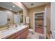 Double vanity bathroom with walk-in closet at 7482 Brooklyn Dr, Kissimmee, FL 34747