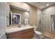 Bathroom with modern vanity, glass shower, and toilet at 7482 Brooklyn Dr, Kissimmee, FL 34747