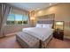 Main bedroom with plush bed and large window at 7482 Brooklyn Dr, Kissimmee, FL 34747