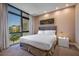 Main bedroom with a king-size bed and large window at 7482 Brooklyn Dr, Kissimmee, FL 34747