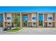 Modern townhome community with reserved parking and golf cart at 7482 Brooklyn Dr, Kissimmee, FL 34747
