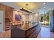 Modern kitchen with dark wood cabinets and large island at 7482 Brooklyn Dr, Kissimmee, FL 34747