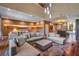 Open living area with sectional sofa and city-themed wall art at 7482 Brooklyn Dr, Kissimmee, FL 34747