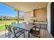 Outdoor kitchen and dining area on a covered patio at 7482 Brooklyn Dr, Kissimmee, FL 34747