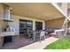 Outdoor patio with built-in grill, seating area, and dining table at 7482 Brooklyn Dr, Kissimmee, FL 34747