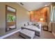 Sitting area in guest bedroom with comfortable seating and large art piece at 7482 Brooklyn Dr, Kissimmee, FL 34747