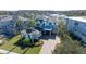 Two-story house with gray siding, blue accents, and a large yard at 9406 Dugard Ct, Orlando, FL 32827