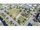 Aerial view of community park with playground and open green space at 9406 Dugard Ct, Orlando, FL 32827