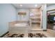 Spa-like bathroom with soaking tub and a separate shower at 9406 Dugard Ct, Orlando, FL 32827