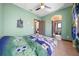 Bedroom with a full-size bed and access to a private bathroom at 9406 Dugard Ct, Orlando, FL 32827