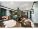 Spacious main bedroom with a large canopy bed and sitting area at 9406 Dugard Ct, Orlando, FL 32827