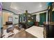 Main bedroom with a king-size bed, sitting area and ensuite bathroom at 9406 Dugard Ct, Orlando, FL 32827